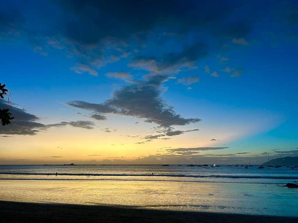 Sunset over sailboats at Playa Tamarindo